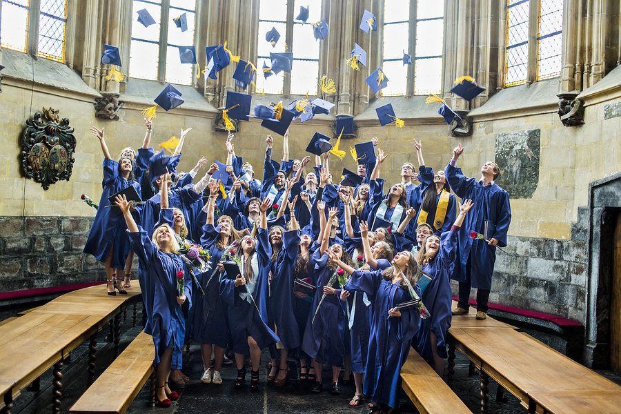 The class of 2016 filling a gothic hall with caps