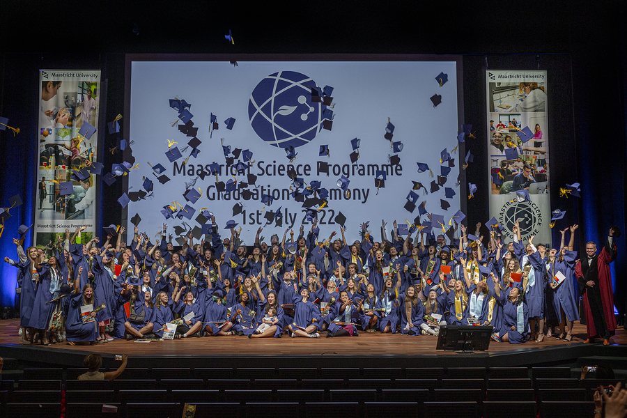 Caps in front of the MSP globe, class of 2022
