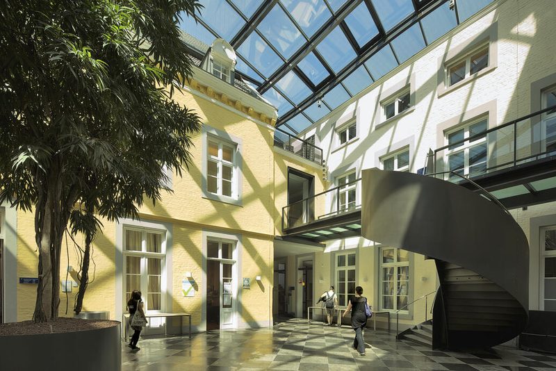 The glass-roofed atrium with spiral staircase inside Kapoenstraat 2